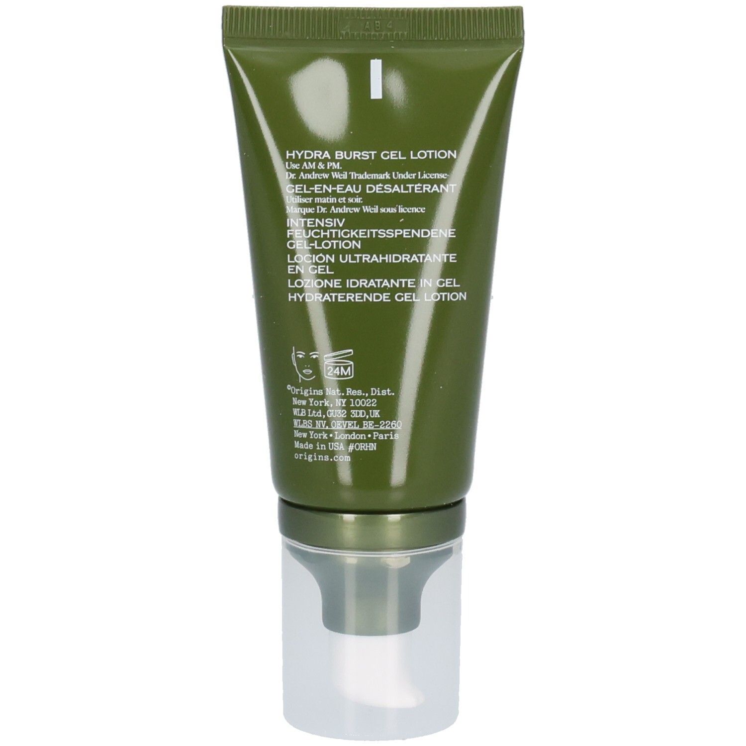 Dos du tube vert. Texte multilingue. Tête de pompe transparente.