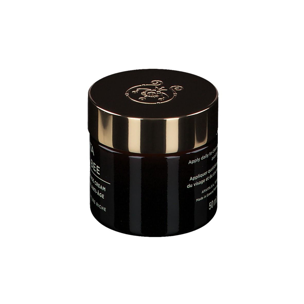Pot de crème brun foncé avec couvercle doré. Inscription : Apivita Queen Bee, Holistic Age Defense Cream.