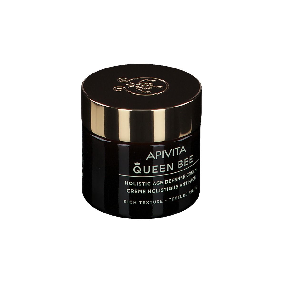 Pot de crème brun foncé avec couvercle doré. Inscription : Apivita Queen Bee, Holistic Age Defense Cream.