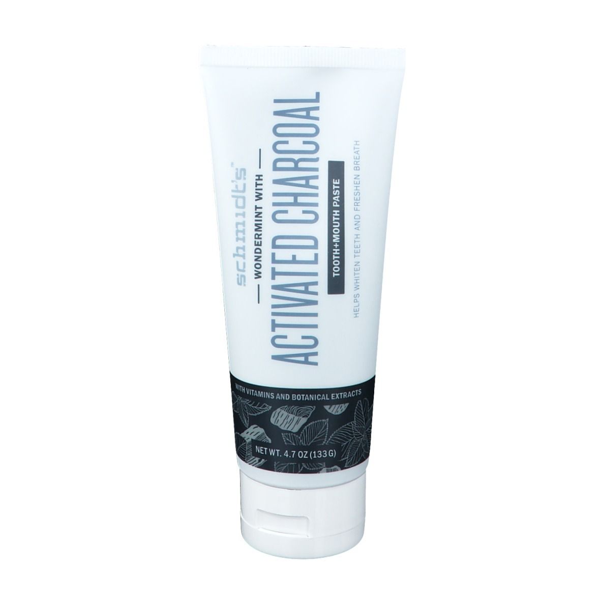 Tube de dentifrice au charbon actif. Inscription: Activated Charcoal, aide à blanchir les dents et rafraîchir l'haleine.