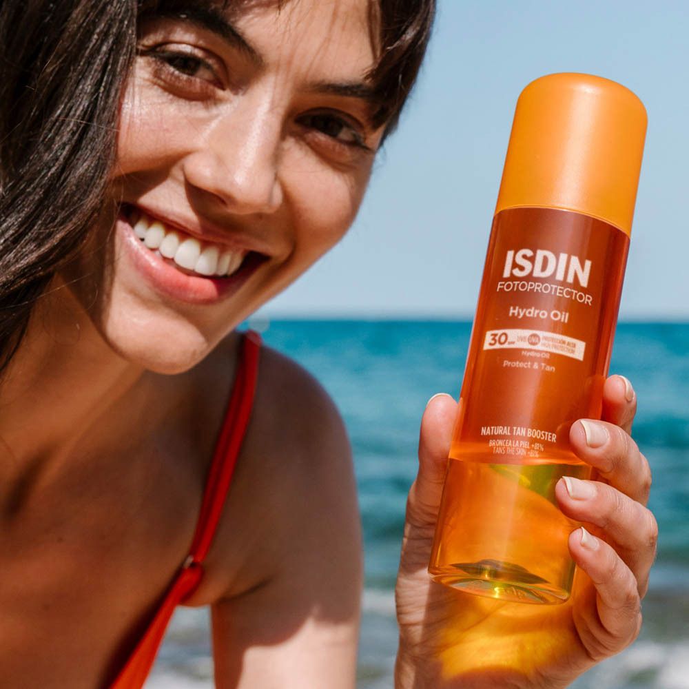 ISDIN HydroOil SPF 30. Texture huileuse. Flacon avec vaporisateur. Bouchon orange. Inscription.