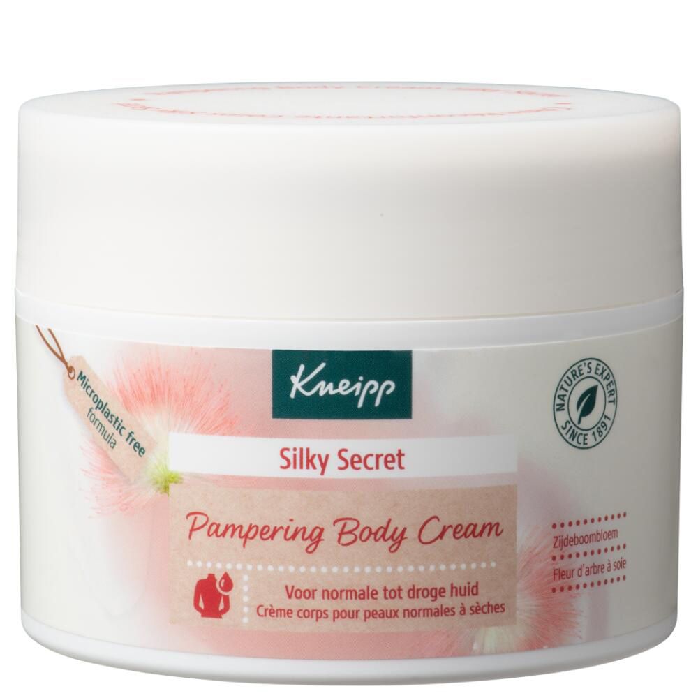 Pot blanc Kneipp Silky Secret Pampering Body Cream. Inscription : Pour peaux normales à sèches. Formule sans microplastiques.