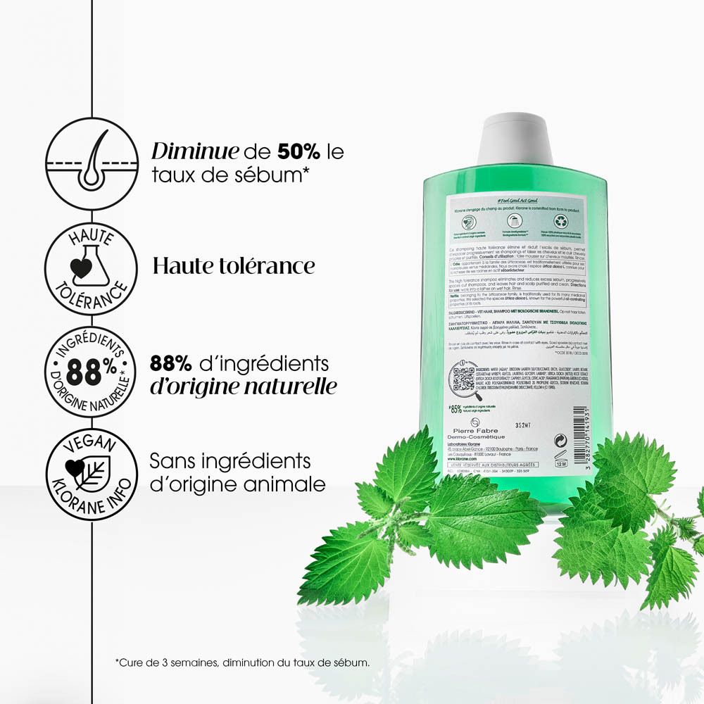 Dos du flacon de shampooing. Texte: Diminue de 50% le taux de sébum, 88% Ingrédients d'origine naturelle.