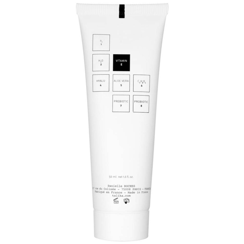 Dos d'un tube blanc. Symboles carrés avec ingrédients. Texte: 50 ml, fabriqué en France.