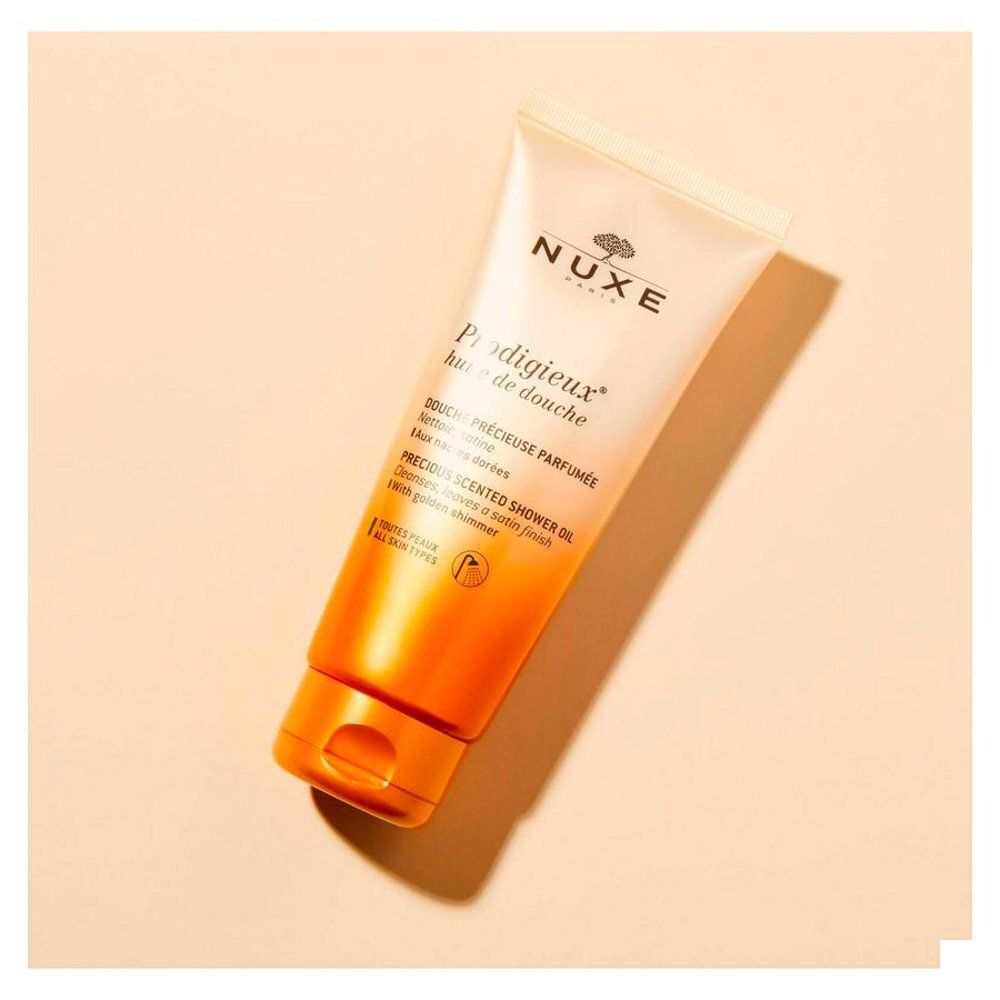 NUXE Prodigieux Huile de Douche: Tube avec offre spéciale, fini satiné et nacres dorées.