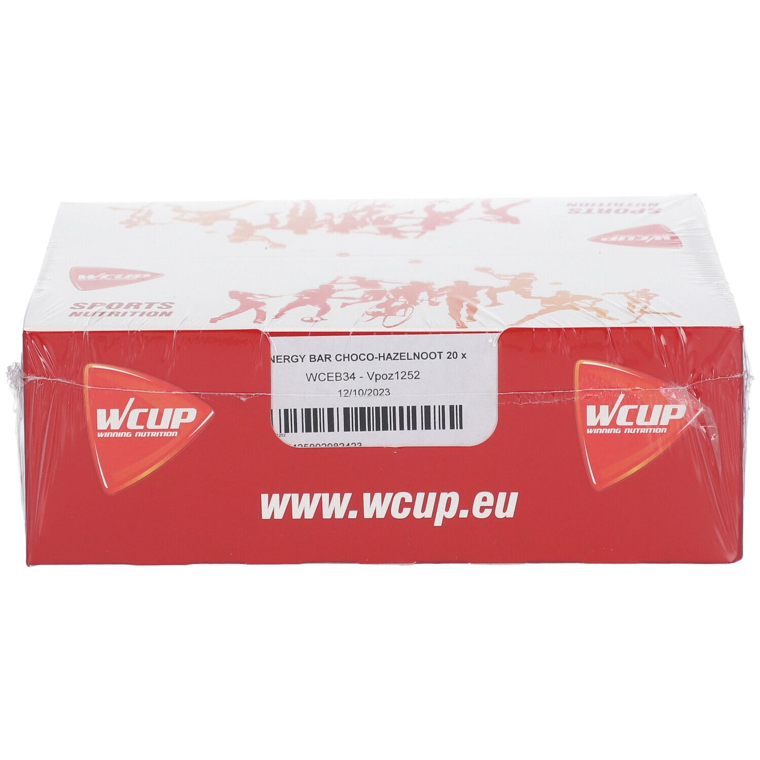 Emballage WCUP. Carton rouge, couvercle blanc. Inscription: ENERGY BAR CHOCO-HAZELNOOT 20 x. www.wcup.eu. Emballé dans du plastique transparent.