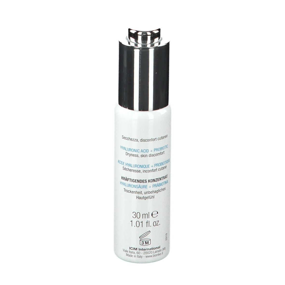 Flacon blanc avec bouchon argenté. Inscription : 30 ml e, 1.01 fl. oz. Texte en italien.