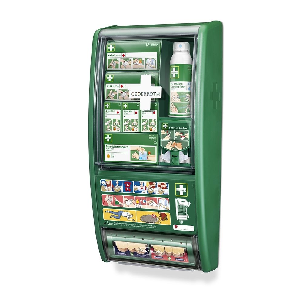 Station de premiers secours verte ouverte, vue détaillée du contenu et des compartiments.