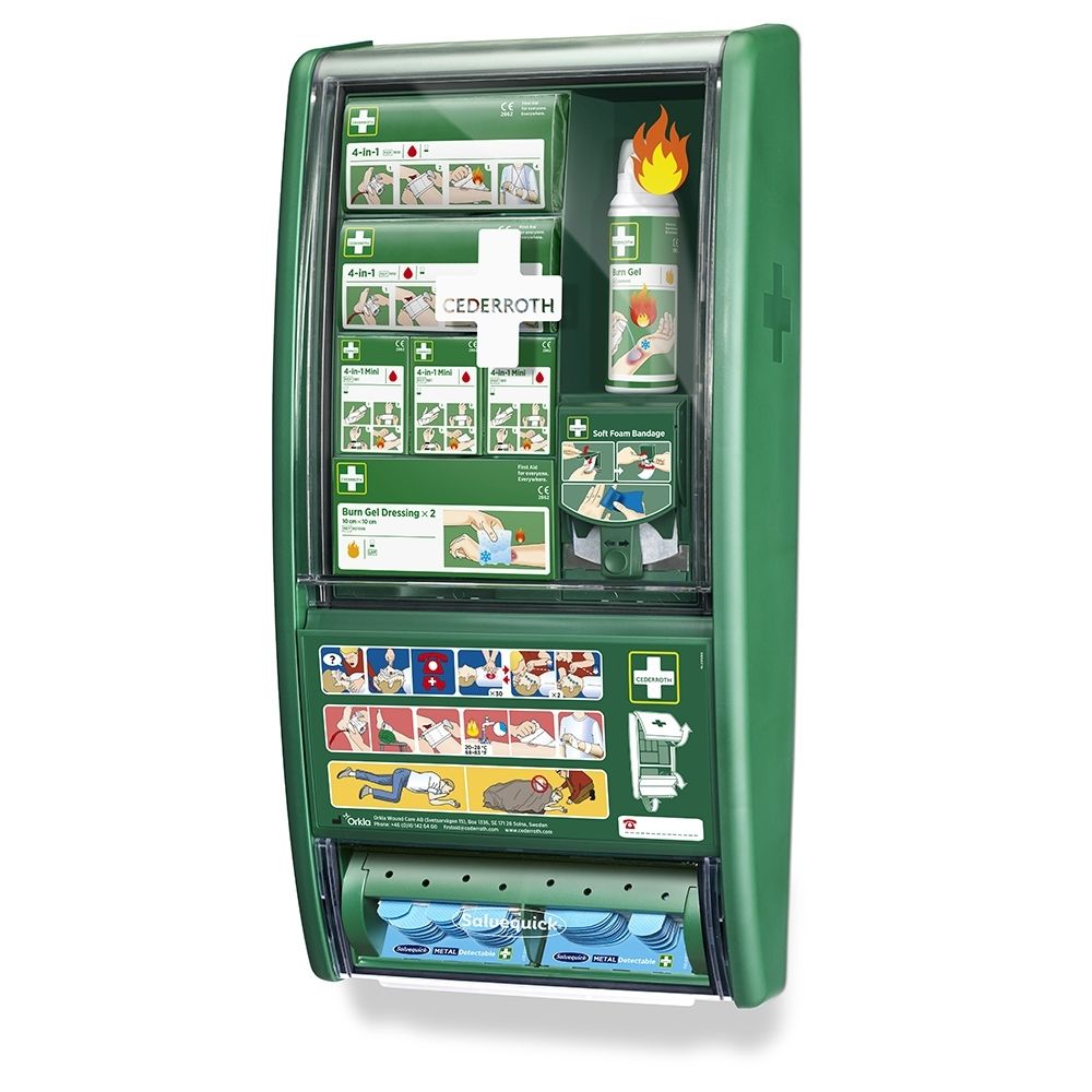 Station verte de premiers secours et brûlures, rabats ouverts, montre le matériel de premiers soins et un spray.