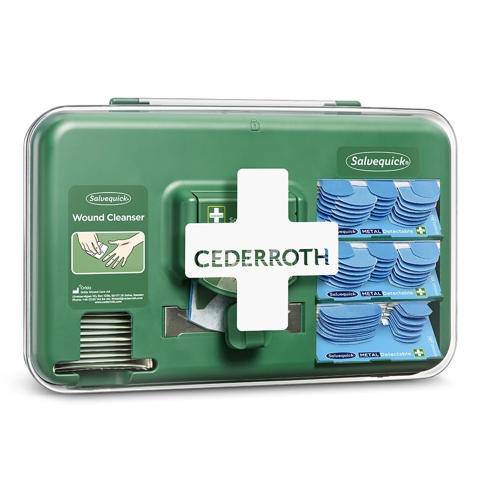Distributeur Cederroth pour soins des plaies, vert, fermé, avec croix blanche et matériel de pansement.