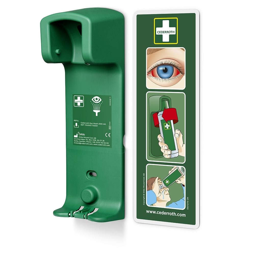 Support mural vert pour lavage oculaire, avec support et graphiques d'instructions.