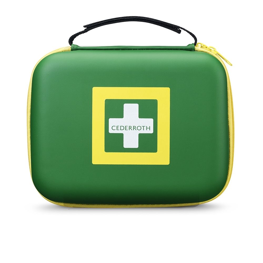 Boîte de premiers secours ouverte avec compartiments, matériel de bandage, ciseaux et pansements. Le contenu est bien organisé.
