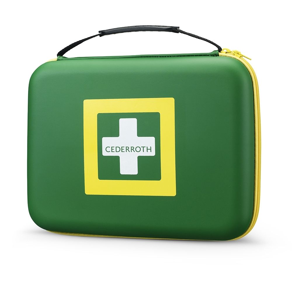 Sac de premiers secours vert ouvert avec cadre jaune, montrant le contenu, y compris les pansements.