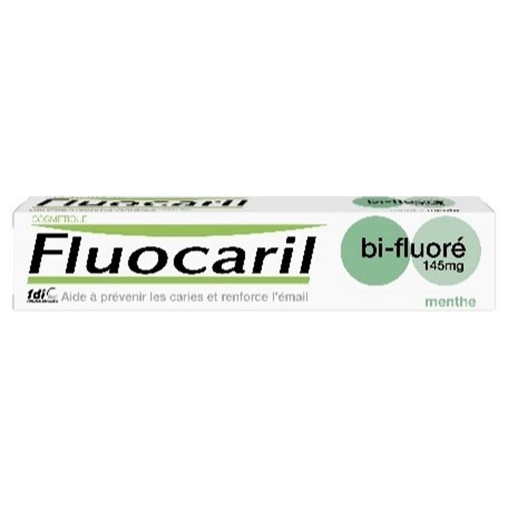 Tube de dentifrice. Inscription: Fluocaril, bi-fluoré 145mg, menthe. Avec logo fdi.