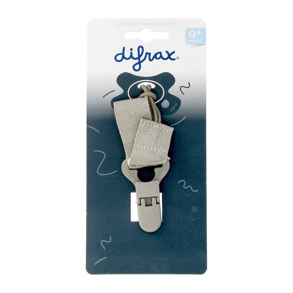 Attache-sucette avec clip et boucle. Ruban gris, clip et support gris. Emballage avec logo et texte 'Keep me close'.