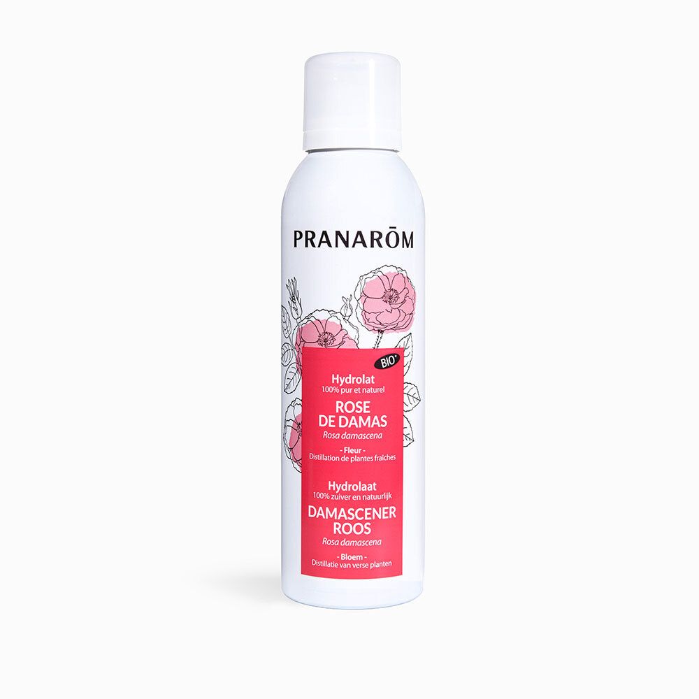 Flacon spray blanc, étiquette rose. Inscription: PRANAROM, Rose de Damas, Hydrolat. Certification bio.