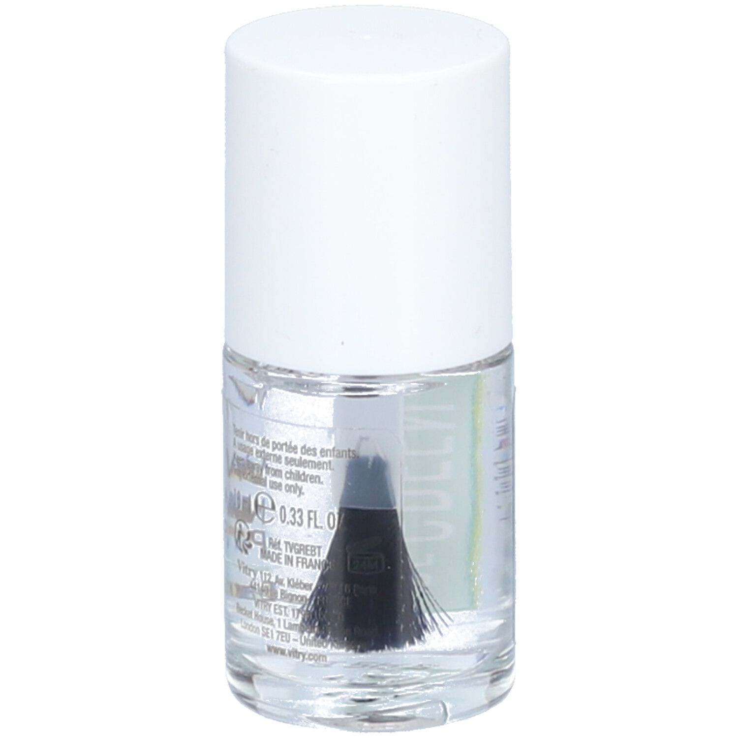 Flacon de vernis à ongles transparent avec bouchon blanc. Pinceau visible. Étiquette avec ingrédients et informations fabricant.