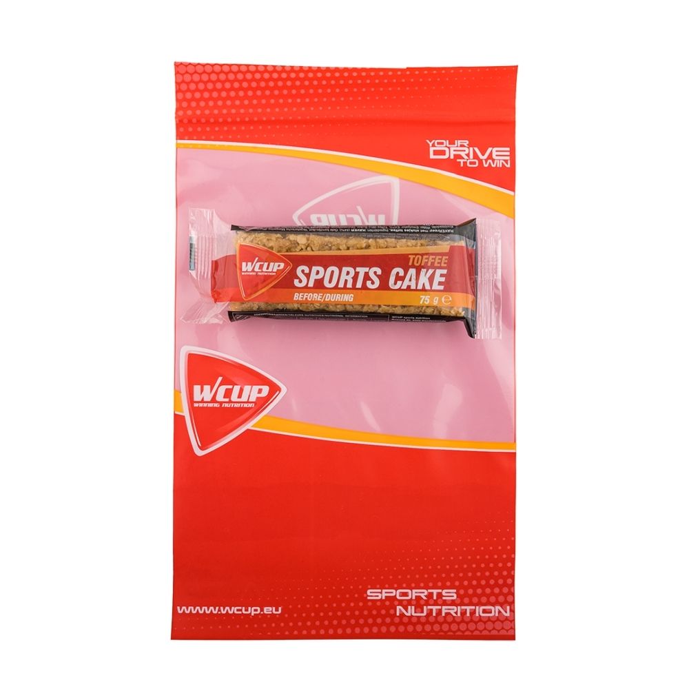 Barre WCUP Sport Cake Toffee emballée individuellement, dans une pochette rouge et orange.