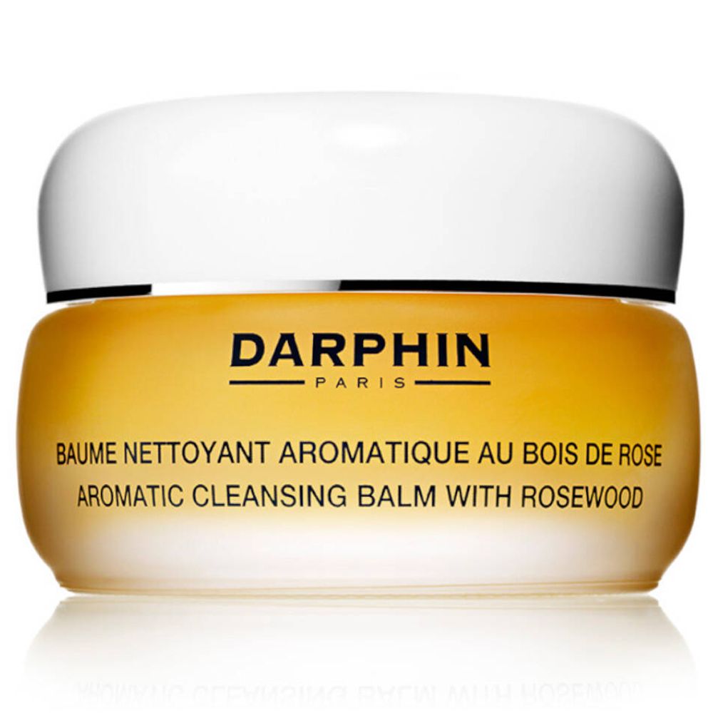 Pot jaune-doré avec couvercle blanc. Inscription DARPHIN PARIS. Nom du produit : BAUME NETTOYANT AROMATIQUE AU BOIS DE ROSE.