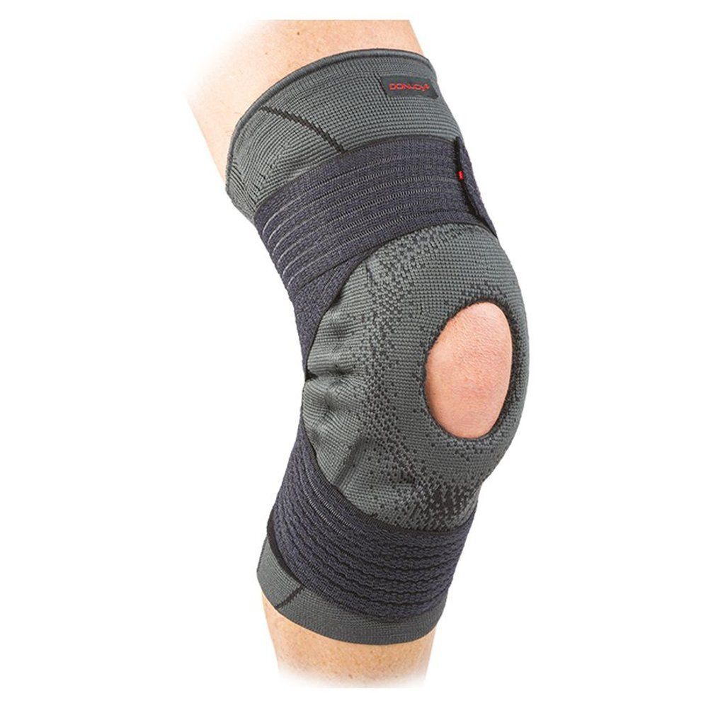 Genouillère grise et noire avec ouverture rotulienne. Marque DonJoy® visible.