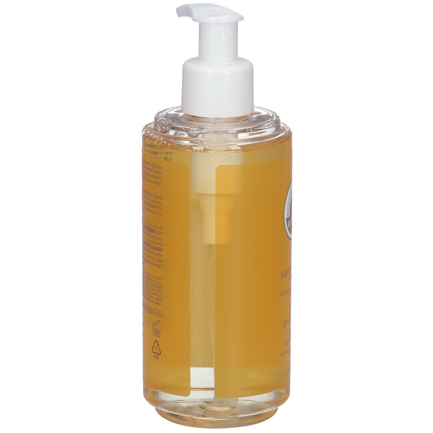 Vue arrière du savon liquide avec pompe. Récipient transparent avec liquide jaune. Étiquette avec texte. Tête de pompe blanche.