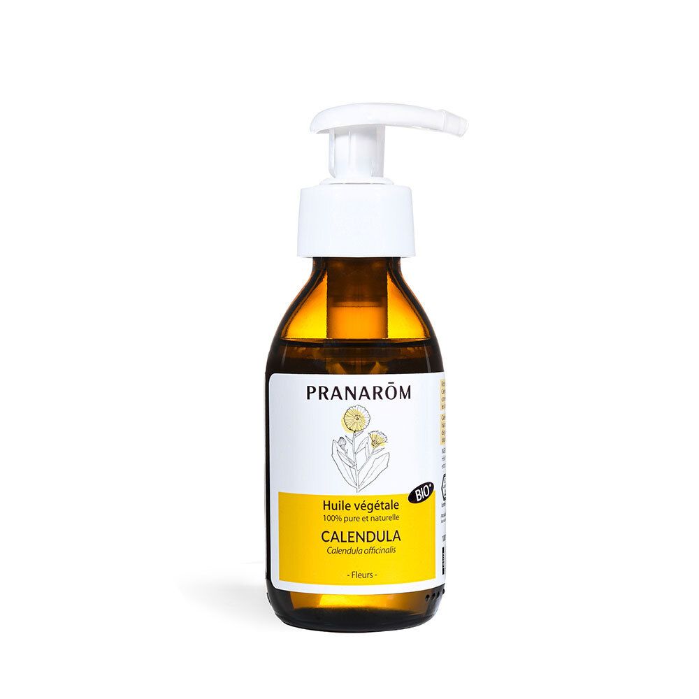 Flacon en verre brun avec pompe. Étiquette avec nom et logo du produit. Contient de l'huile de Calendula.