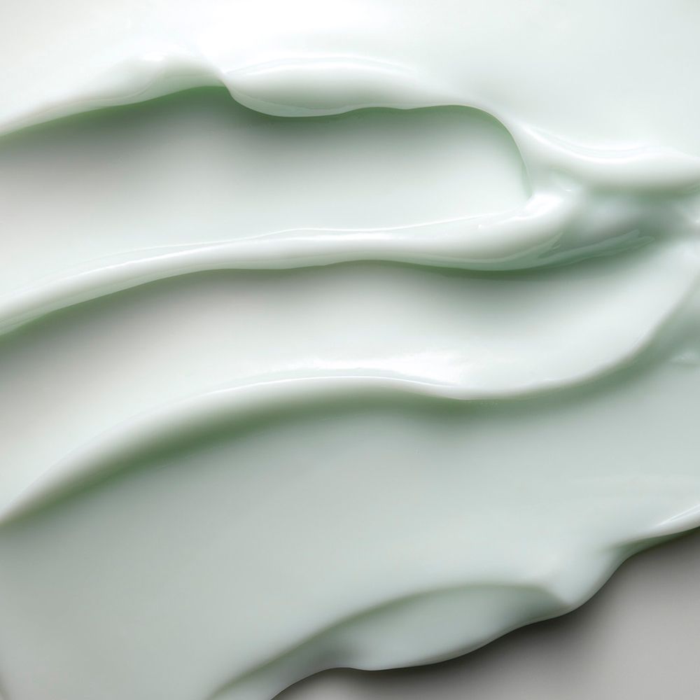 Gros plan sur la crème. Texture vert clair.