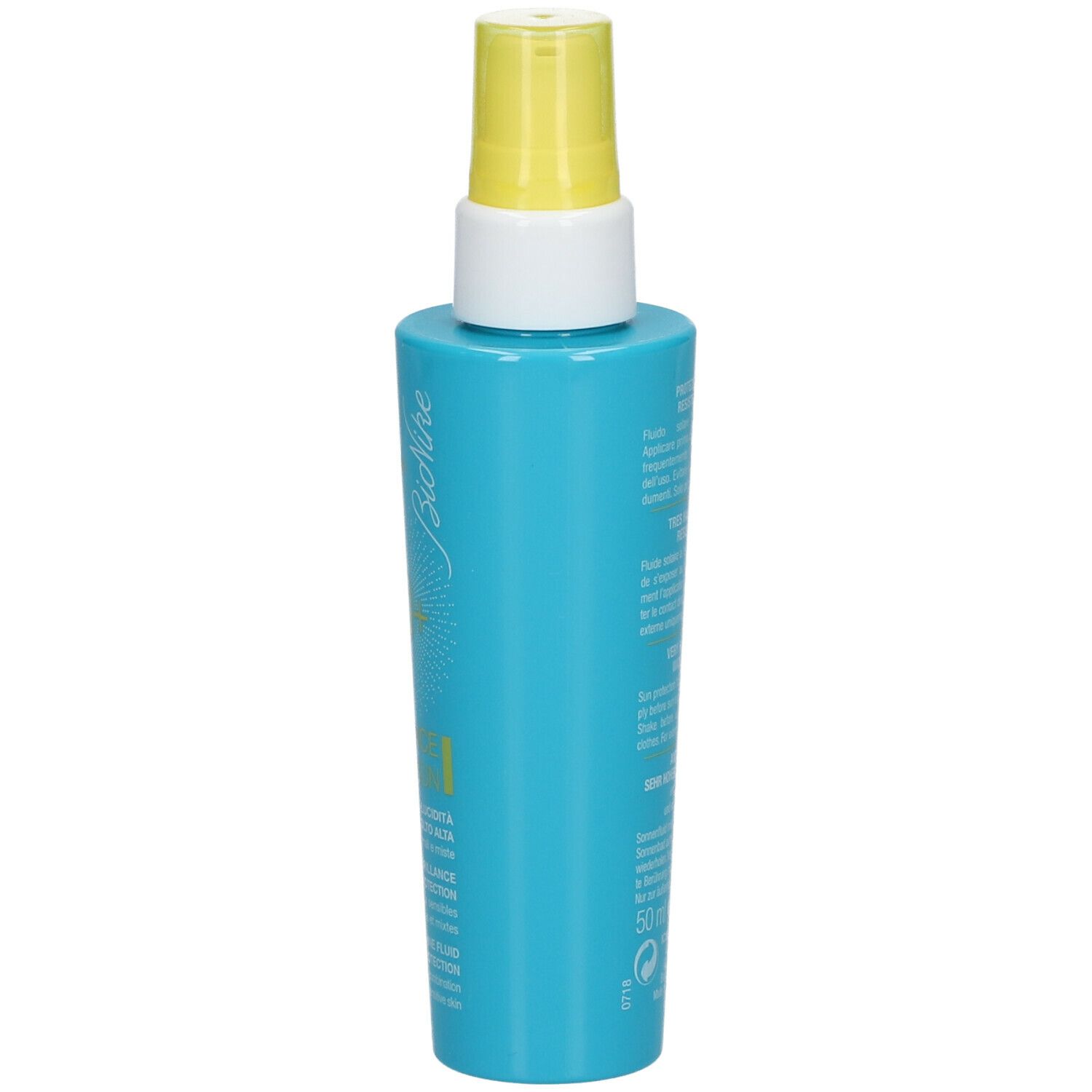 Flacon bleu turquoise avec vaporisateur jaune. Inscriptions : Bionike, 50+, Defence Sun.