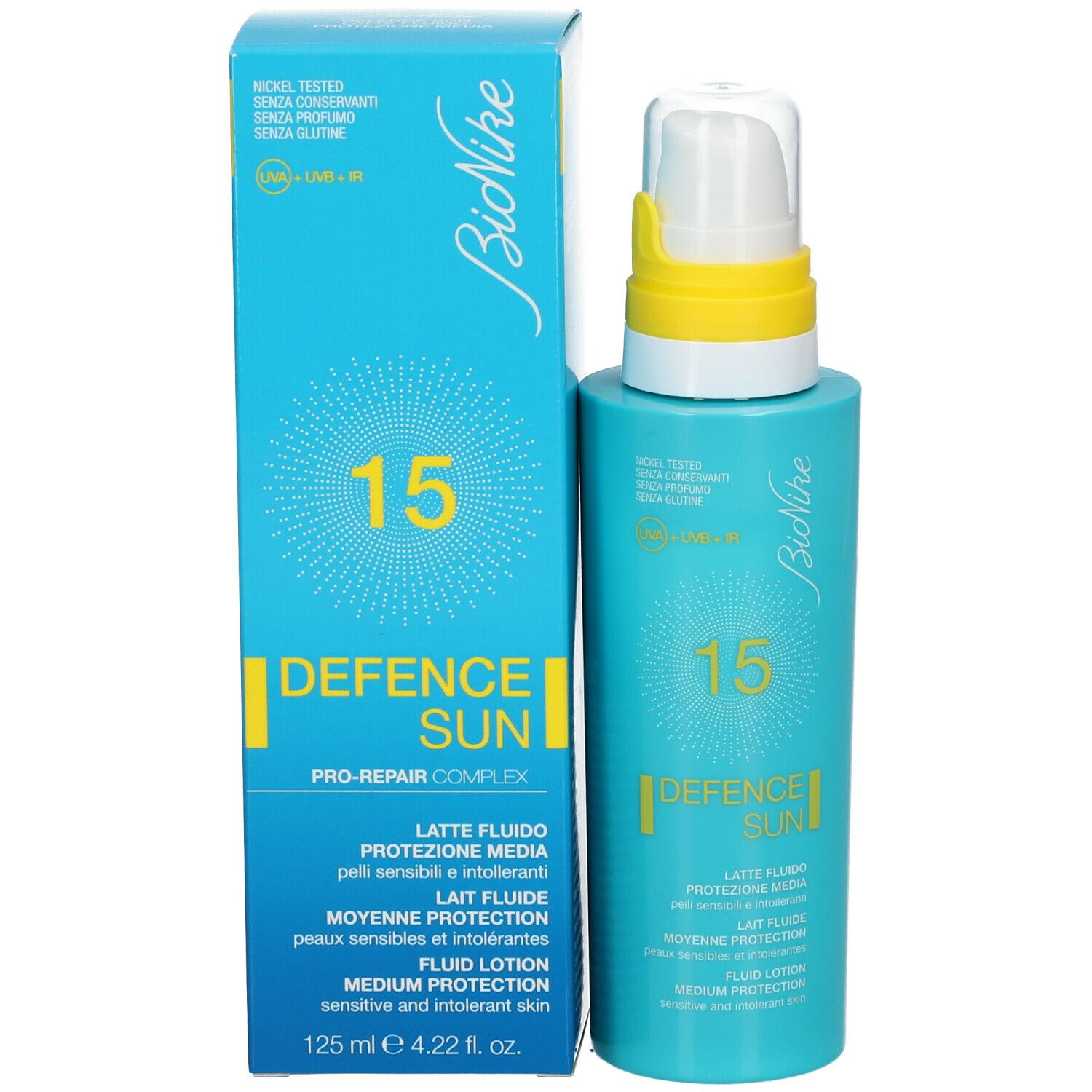 Flacon et boîte bleus turquoise. Inscription: 15, DEFENCE SUN, Lait Fluide, Protection Moyenne, Fluid Lotion. 125 ml.
