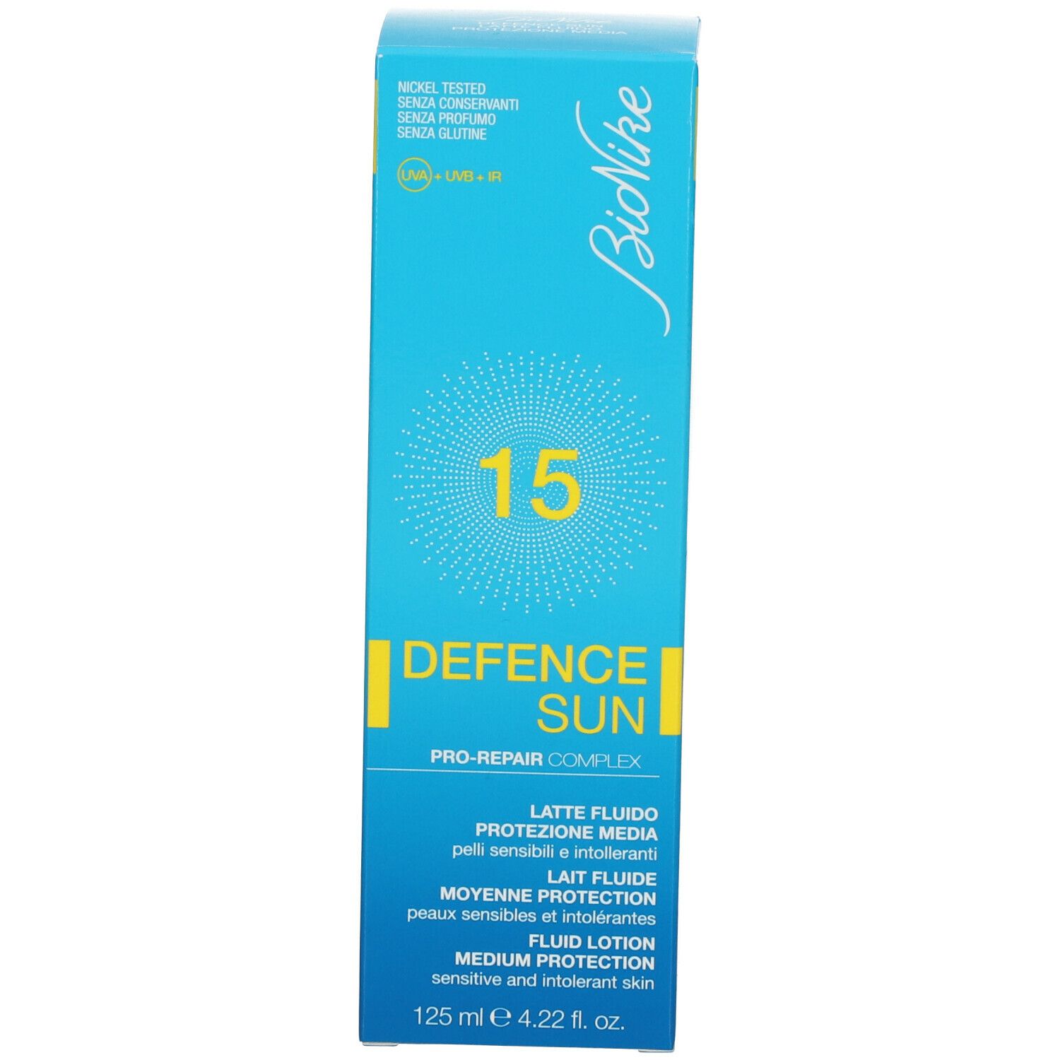 Boîte bleu turquoise. Inscription: 15, DEFENCE SUN, Lait Fluide, Protection Moyenne, Fluid Lotion. 125 ml.