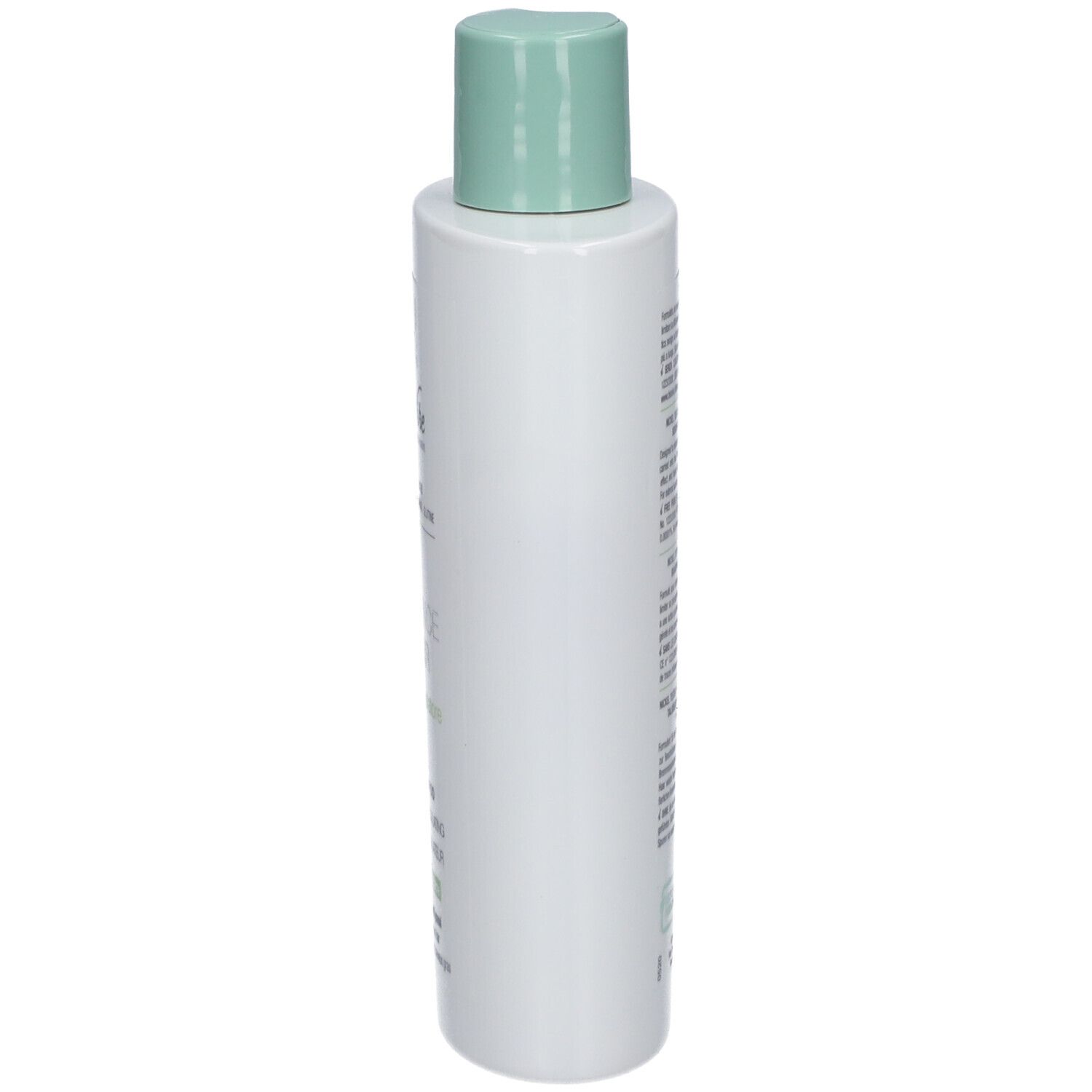Flacon de shampooing blanc, vue latérale. Bouchon vert. Texte sur le flacon.