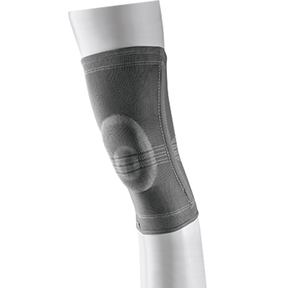 Genouillère 3M™ Futuro™. Medium. Bandage grise sur une jambe. Emballage avec image et texte du produit.
