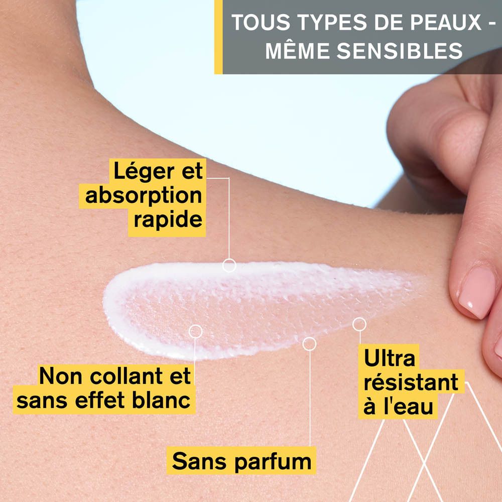 Produit appliqué sur la peau. Texte : Haute protection UVA/UVB, aide à réduire les dommages cellulaires, prévient le photo-vieillissement.