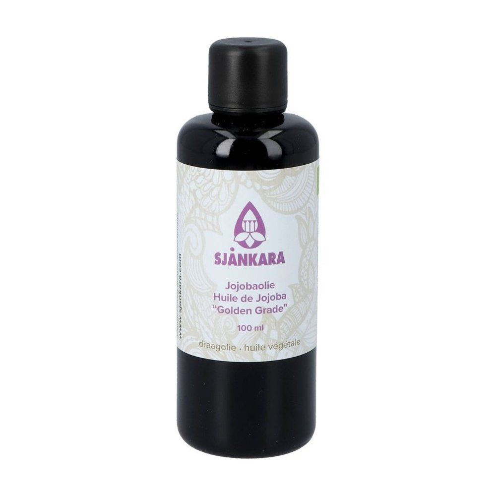 Flacon en verre brun avec bouchon noir. Étiquette avec nom du produit et logo.