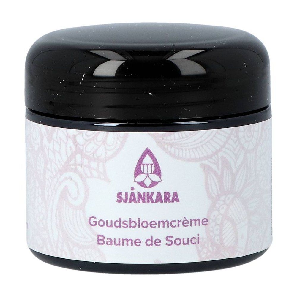 Pot en verre brun avec couvercle noir. Étiquette avec nom du produit et logo.