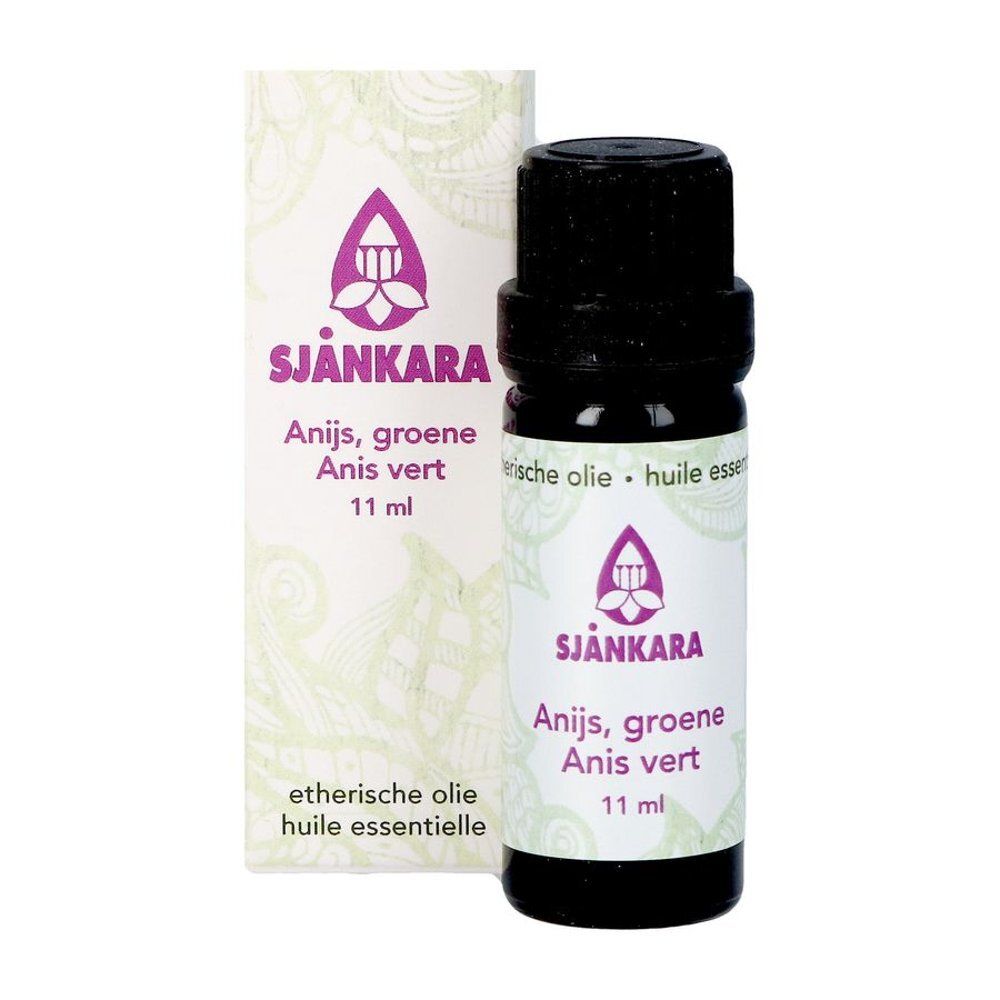 Flacon et emballage d'huile essentielle. Inscription : Sjnkara, Anis vert, 11 ml. Logo et texte violets.