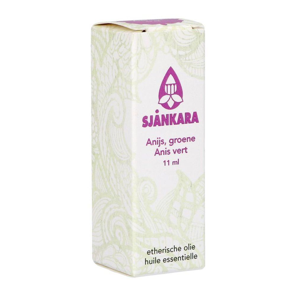 Emballage d'huile essentielle. Inscription : Sjnkara, Anis vert, 11 ml. Logo et texte violets.