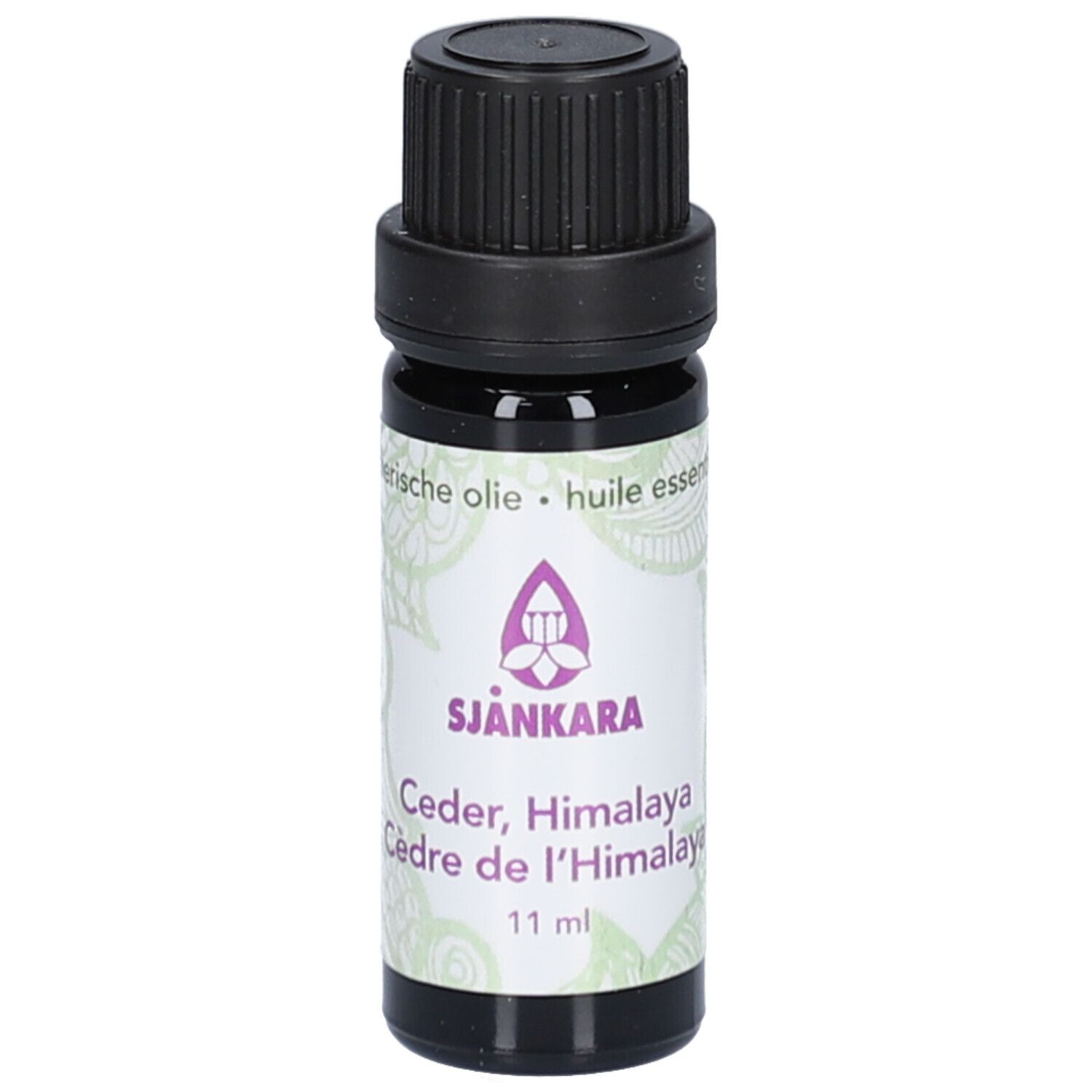 Flacon en verre brun avec bouchon noir. Étiquette avec nom et logo du produit. 11 ml.