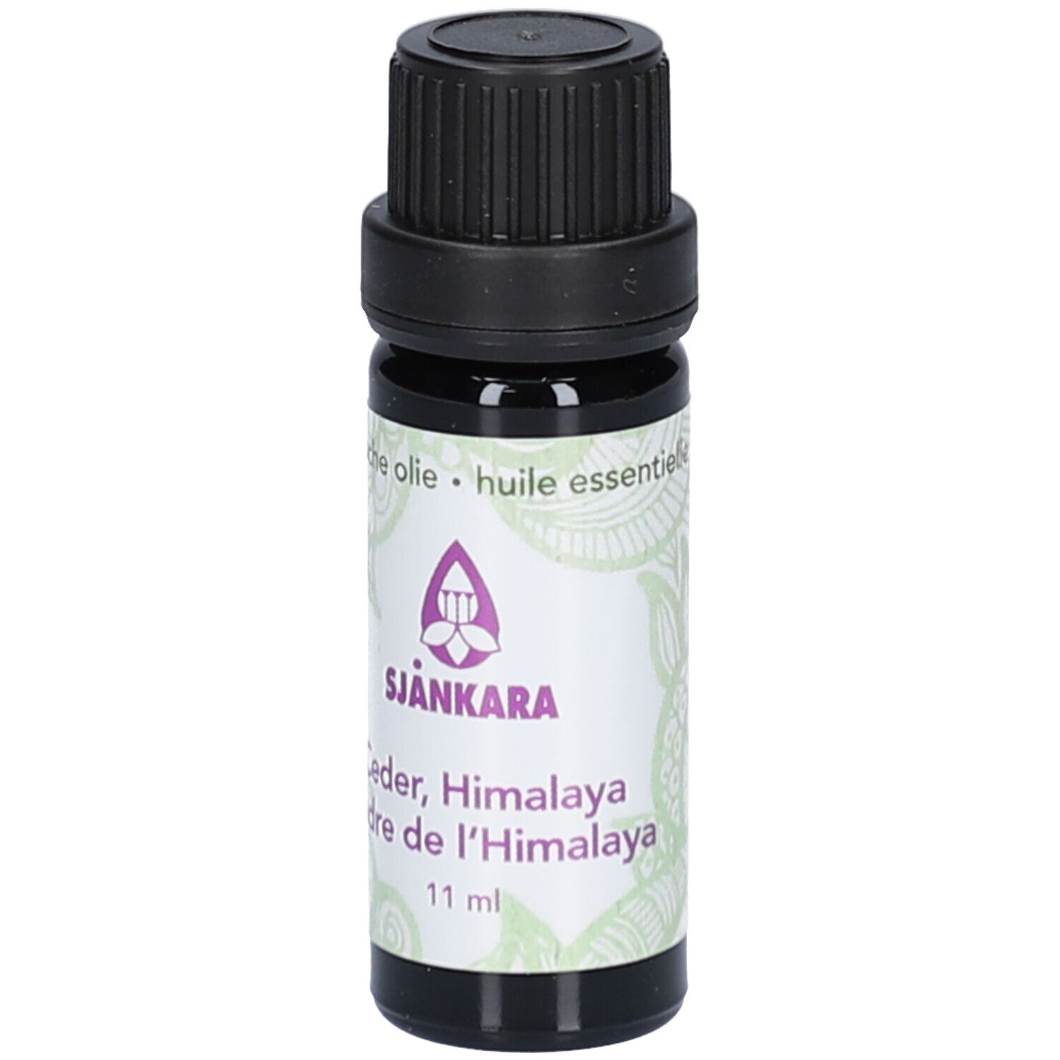 Flacon en verre brun avec bouchon noir. Étiquette avec nom et logo du produit. 11 ml.