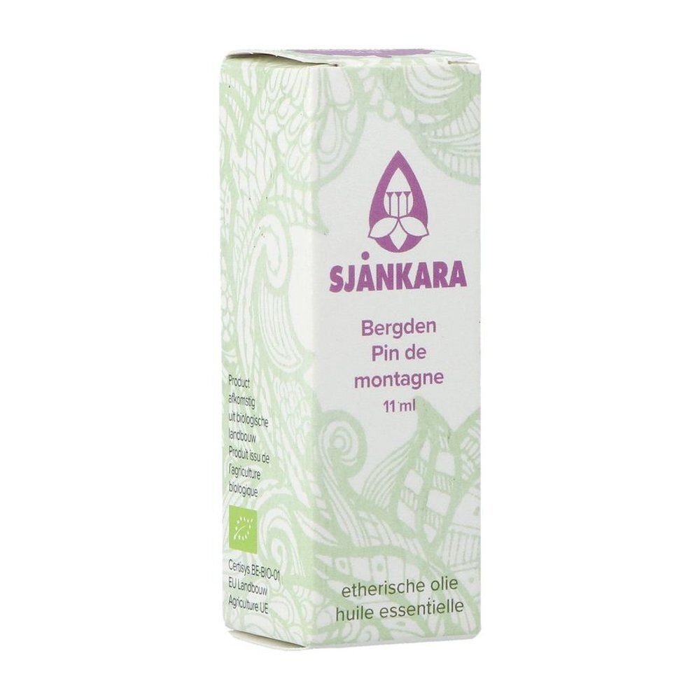 Emballage avec texte et logo. Inscription: Sjanakara, Bergden, Pin de montagne, 11 ml. Avec motif floral et certification bio.