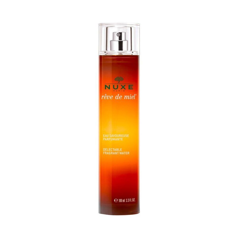 Flacon Nuxe Rêve de Miel Eau Savoureuse Parfumante avec vaporisateur. Design dégradé brun et jaune.
