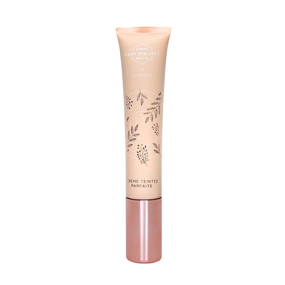 Tube de crème CC. Inscriptions: Cent Pur Cent, Nomige. Motif floral. Bouchon rose.