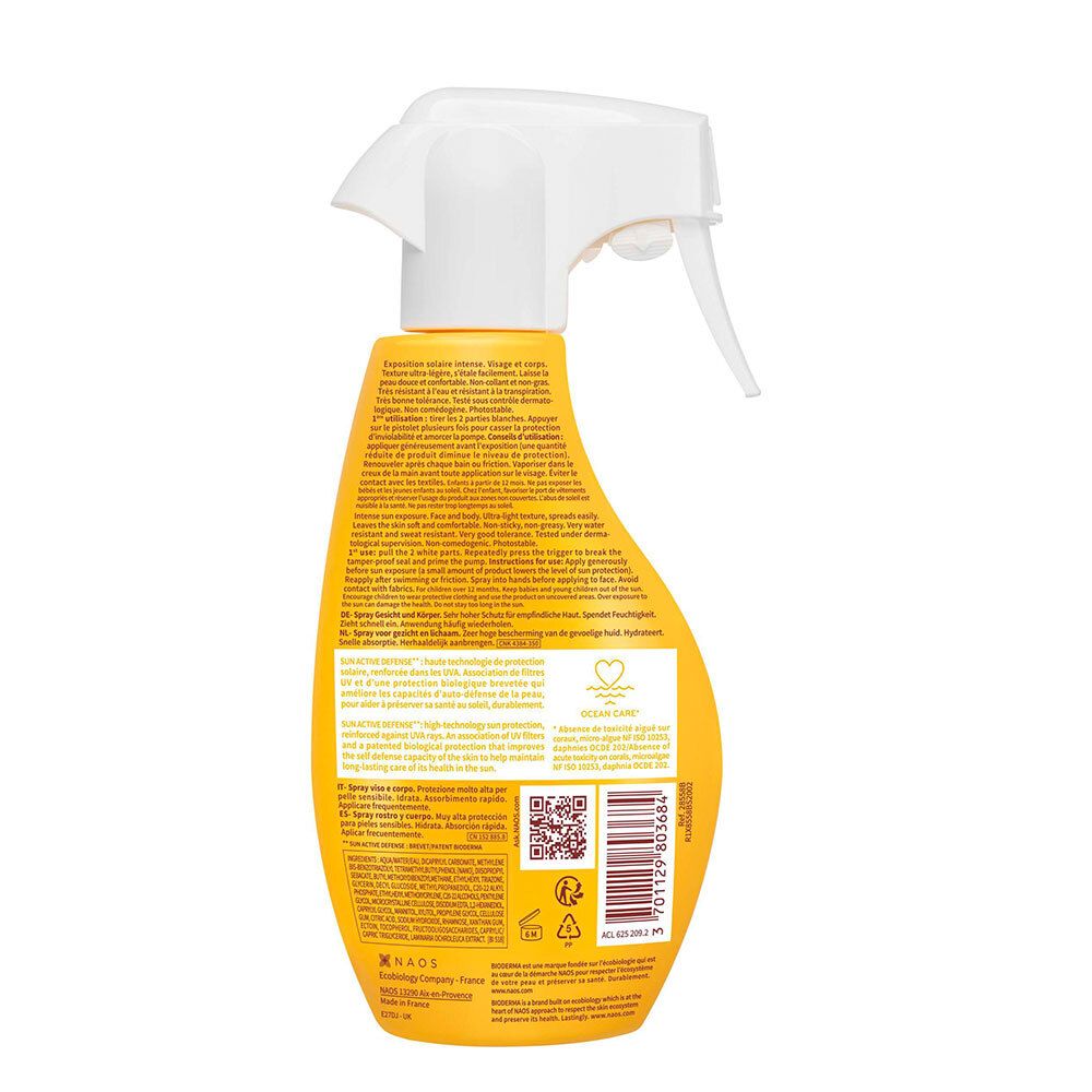 Dos d'un flacon spray jaune. Informations textuelles, code QR et logos. Tête de pulvérisation blanche.
