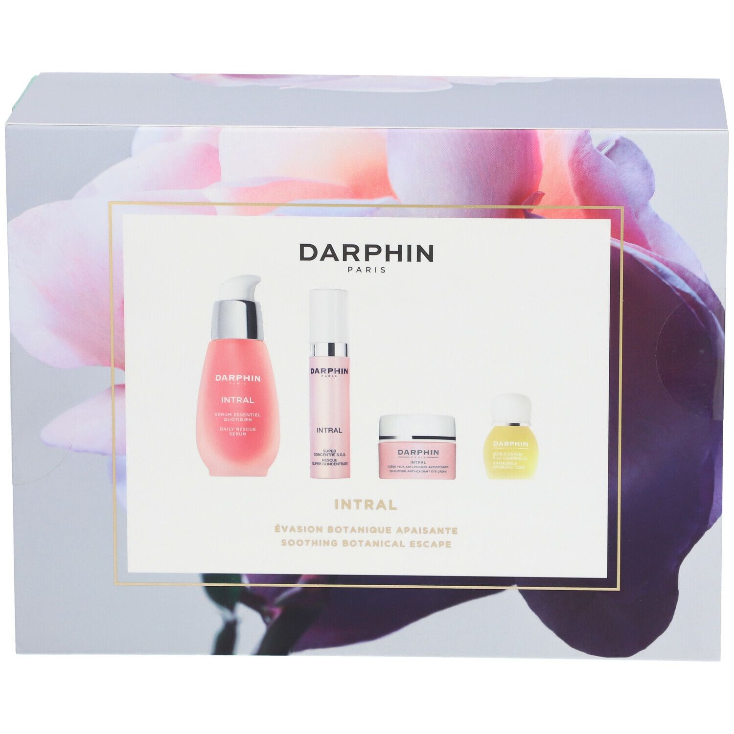 Coffret cadeau avec quatre produits. Liquides et crèmes roses dans des contenants blancs et transparents. Inscription : DARPHIN INTRAL.