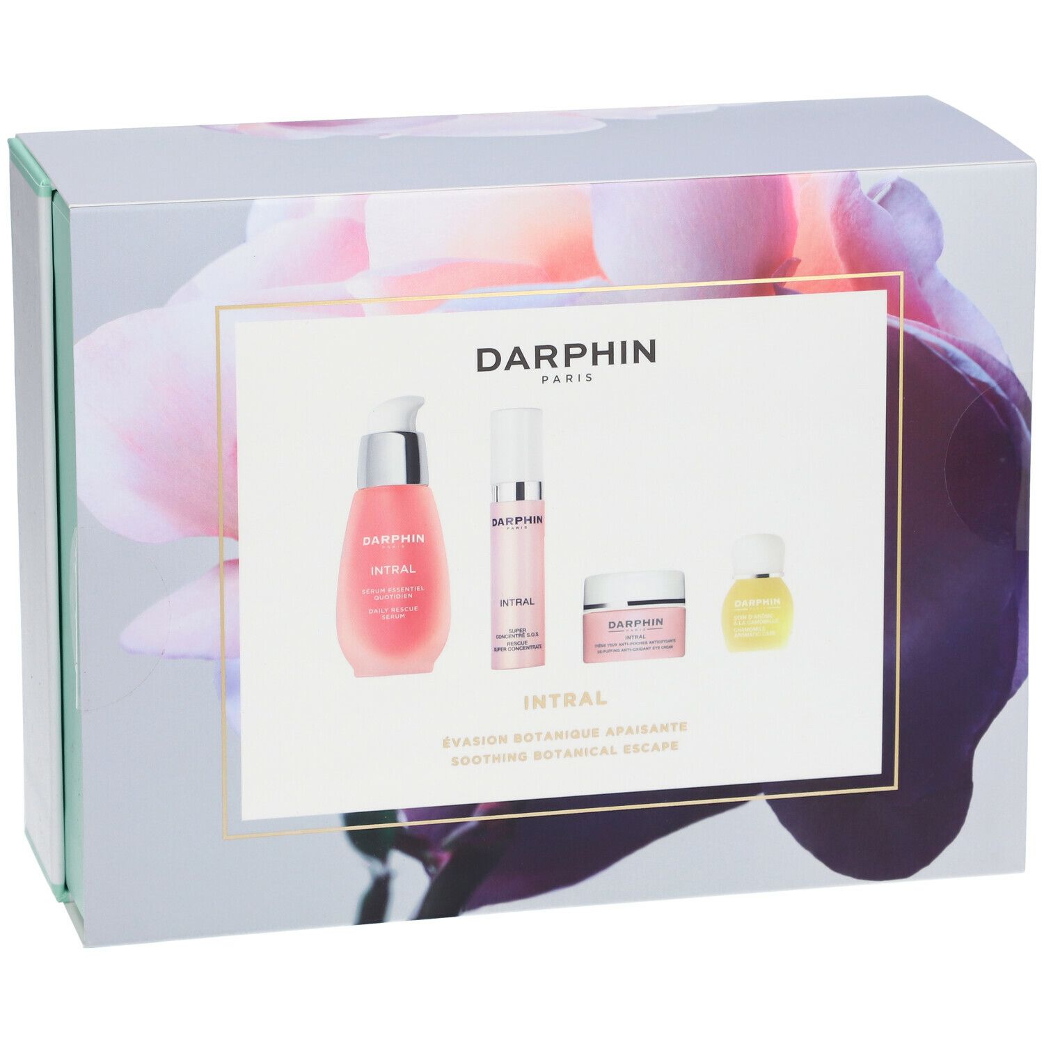 Coffret cadeau avec motif floral et quatre produits. Inscription : DARPHIN. Liquides et crèmes roses. Accents vert menthe et blancs.