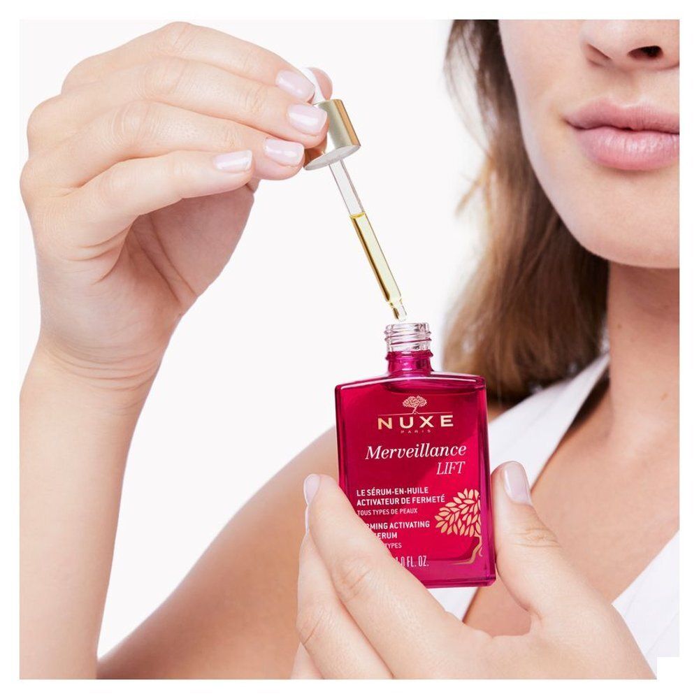 Flacon en verre rouge avec pipette, Sérum-en-Huile Activateur de Fermeté Nuxe Merveillance Lift, 30ml.