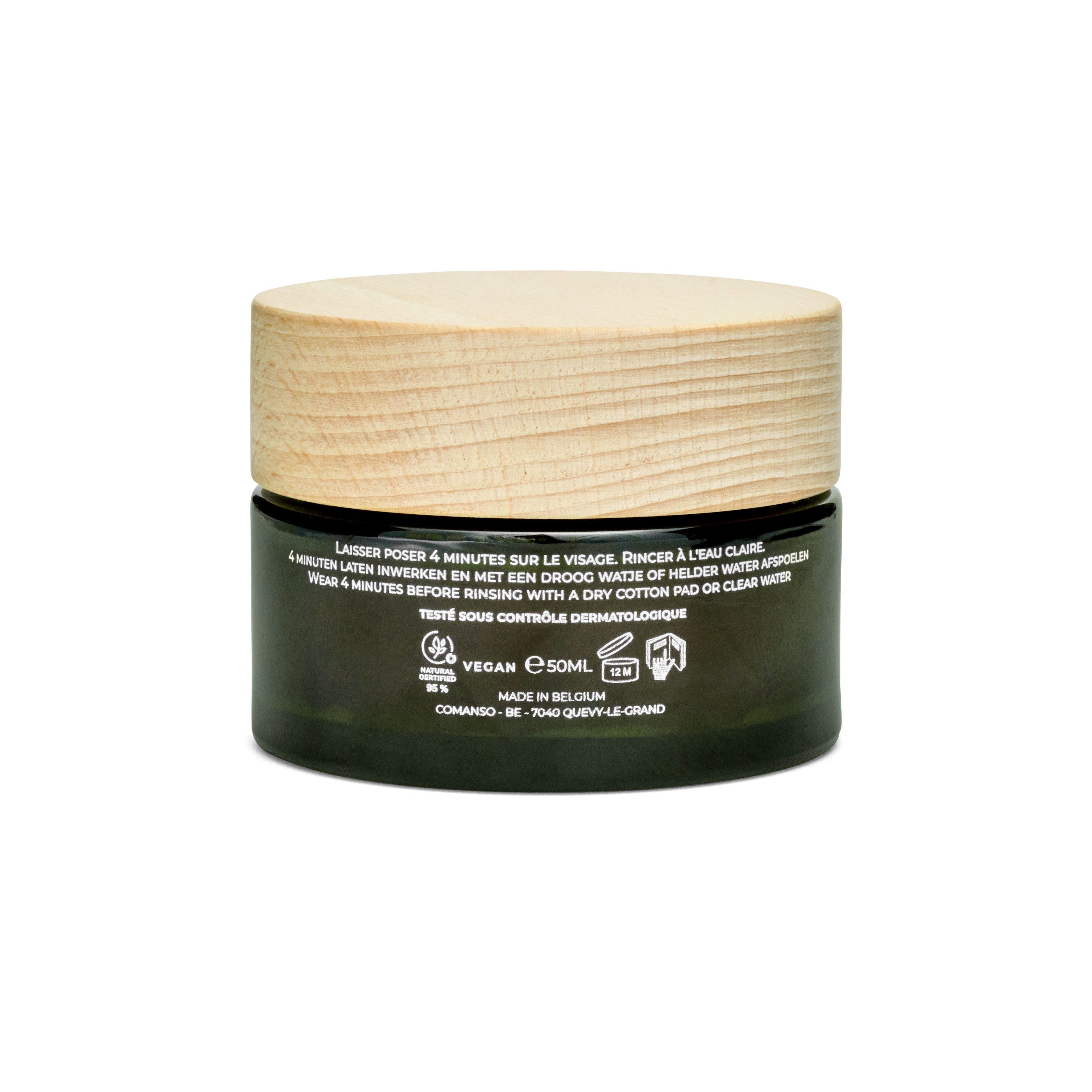 Dos du pot en verre vert avec couvercle en bois. Texte: mode d'emploi, logo Vegan, 50ml.