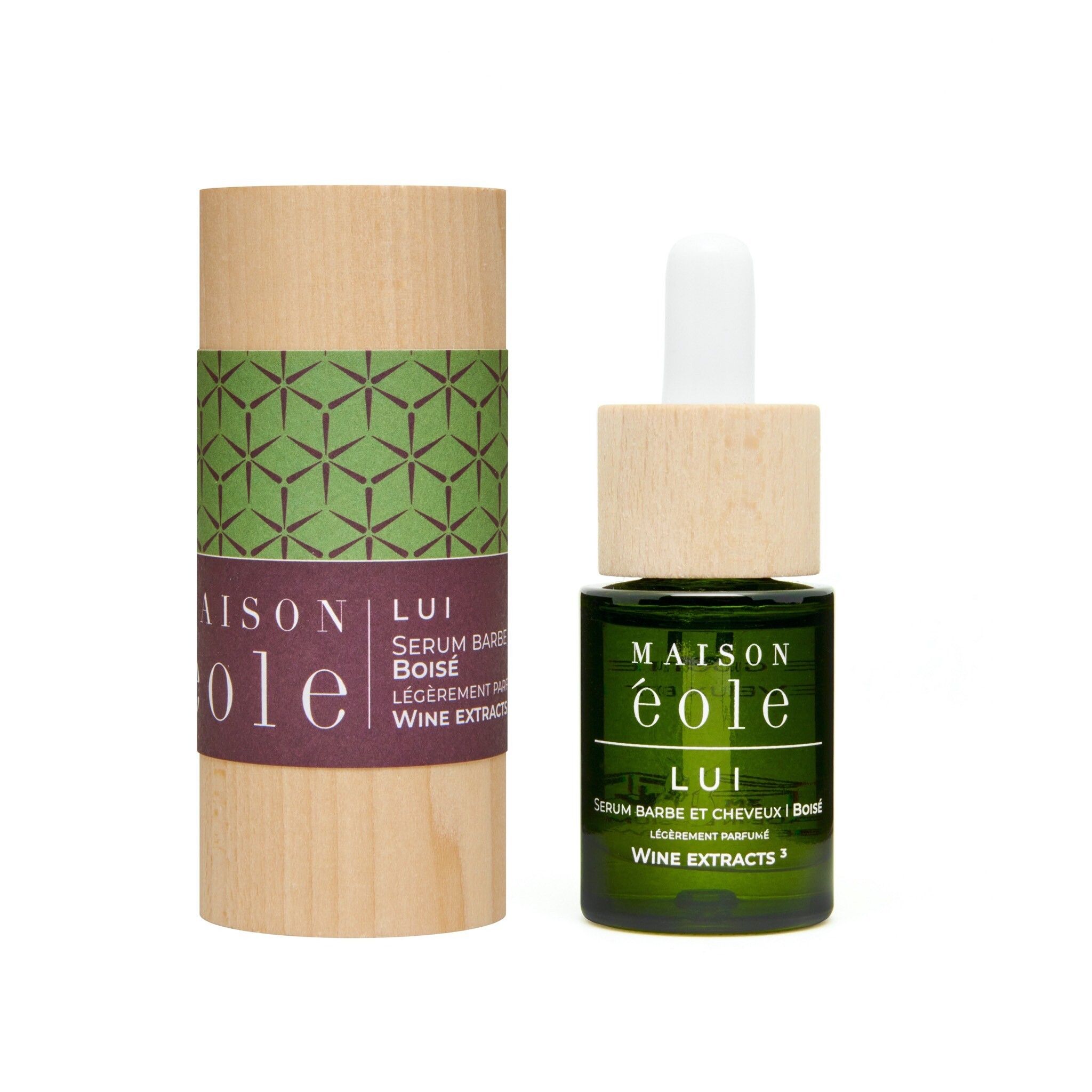 Flacon et emballage. Emballage cylindrique avec motif vert et inscription: Maison Éole, Lui.