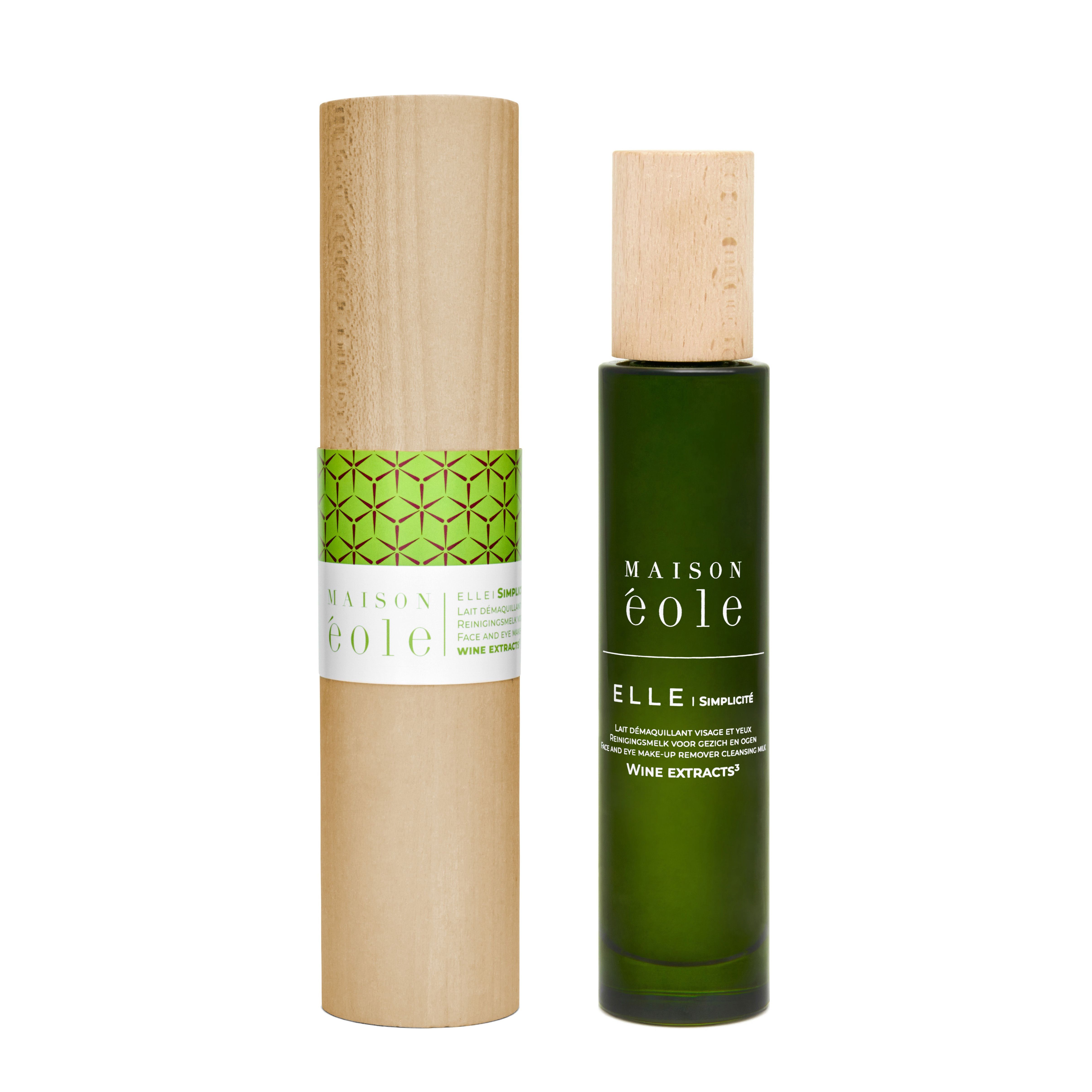 Flacon et emballage. Flacon vert avec bouchon en bois. Emballage cylindrique avec bande verte et inscription.