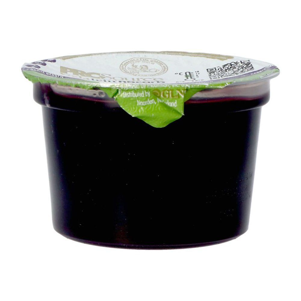 Coupelle noire ronde avec couvercle. Inscription: PROsource Gelatein nocarb Cassis. Couvercle partiellement ouvert.